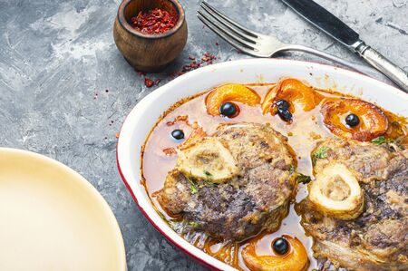 Meat stew with apricot.Ossobuco, traditional dish of Italian cuisine.Stewed calf legの写真素材