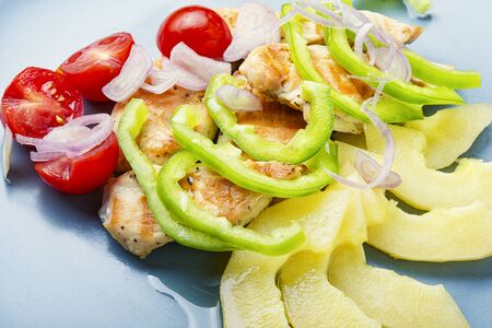 Salad with chicken breast, pepper, pepino and tomato.Dietary salad.Meat saladの写真素材