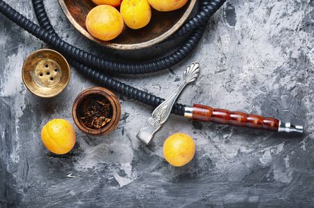 Details of the eastern kalian.Hookah with apricots flavor.Smoking apricots tobaccoの写真素材