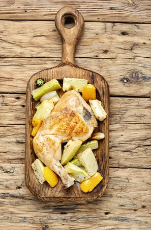 Chicken with vegetables.Chicken thighs baked with zucchini. Grilled chicken.Roasted chicken legsの写真素材