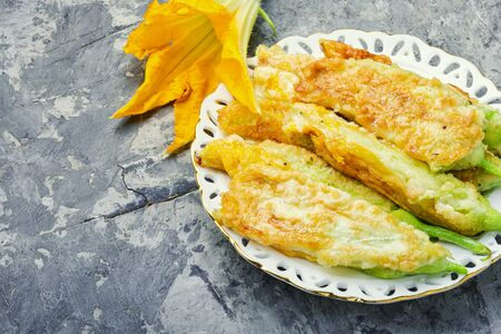Fried zucchini flowers stuffed with cream cheese.の写真素材