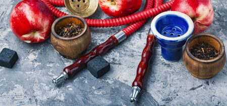 Tobacco shisha with nectarine flavor.Hookah with peach.Fruit hookah tobaccoの写真素材