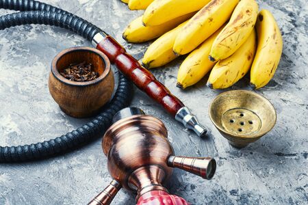 Tobacco shisha with banana flavor.Nargile with banana.Fruit hookah tobaccoの写真素材