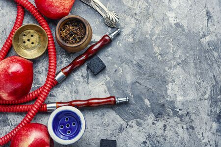 Tobacco shisha with nectarine flavor.Hookah with peach.Fruit hookah tobaccoの写真素材