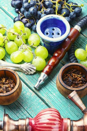 Tobacco shisha with grapes flavor.Nargile with grapes.Turkish fruit hookah tobaccoの写真素材