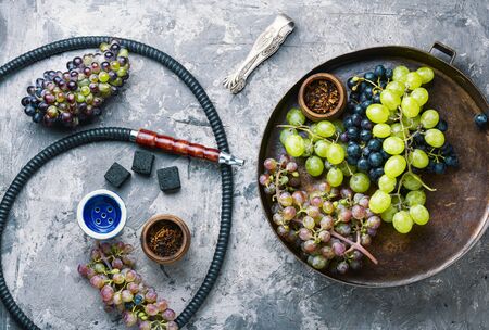 Turkish tobacco hookah with grapes aroma.Kalian with berryの写真素材