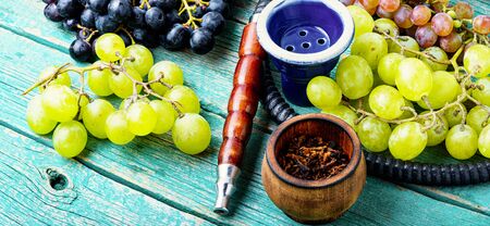 Turkish tobacco hookah with grapes aroma.Kalian with berryの写真素材