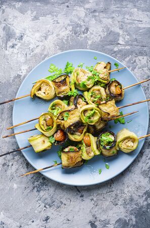 Eggplant and zucchini stuffed with meat on skewers.Banquet snackの写真素材