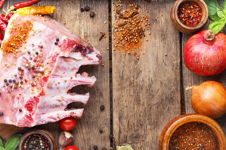 Ribs and pork chops on old wooden tableの写真素材