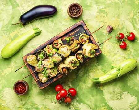Eggplant and zucchini stuffed with meat on skewers.Flat lay with copy spaceの写真素材
