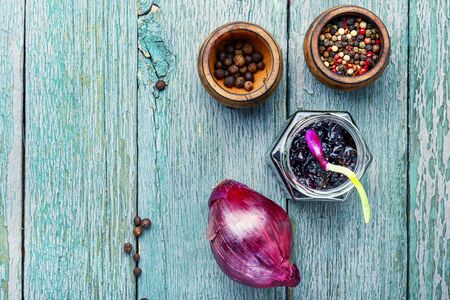 Homemade red onion jam.Onion confiture on old wooden tableの写真素材
