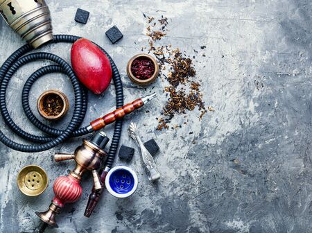Smoking hookah.Details of shisha.Shisha with mango aroma of tobacco.