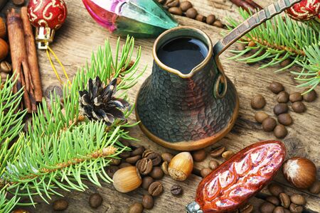 Coffee in retro cezve and christmas decorationの写真素材