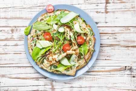 Homemade pancakes with spinach and arugula.Vegetable pancakeの写真素材