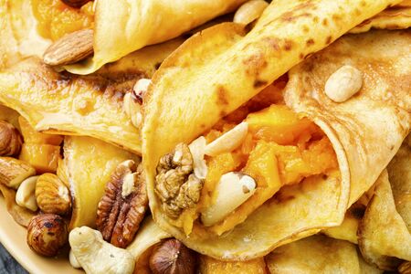 Pancakes stuffed with pumpkin and nut.Autumn food.Food backgroundの写真素材