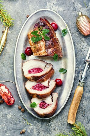 Sliced meatloaf filled with cherries.Christmas dish, festive foodの写真素材