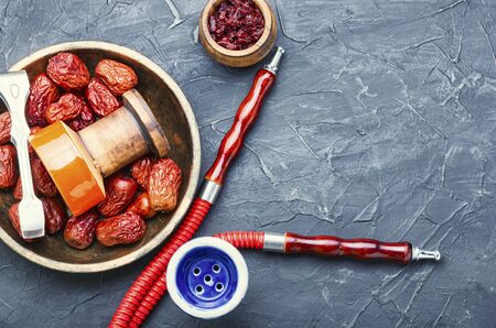 Oriental smoking hookah.Shisha tobacco with aroma of unabi