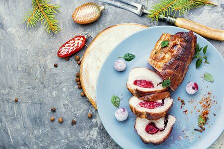Sliced meatloaf filled with cherries.Christmas dish, festive foodの写真素材