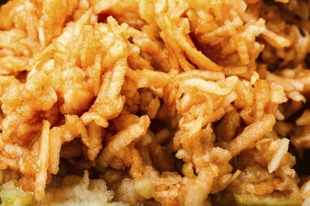 Grated ripe autumn apples fruit salad.Autumn fruit dessert.Food backgroundの写真素材