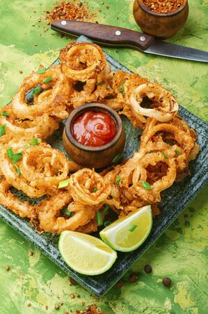 Crunchy deep fried squid rings in batterの写真素材