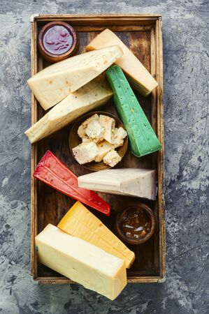 Various kind of cheese served in wooden boxの写真素材