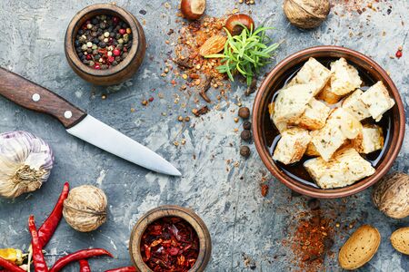 Feta cheese with herbs and garlic in bowlの写真素材