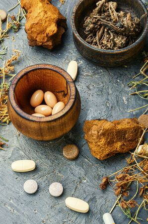 Herbal pills with healthy medical plant.Alternative medicine herbal and pillsの写真素材