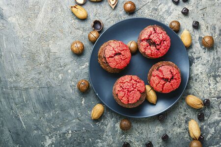 Homemade delicious muffins with nuts and chocolate.の写真素材