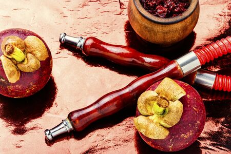 Oriental smoking hookah with hookah tobacco with aroma of mangosteen.Fruit shisha tobacco.