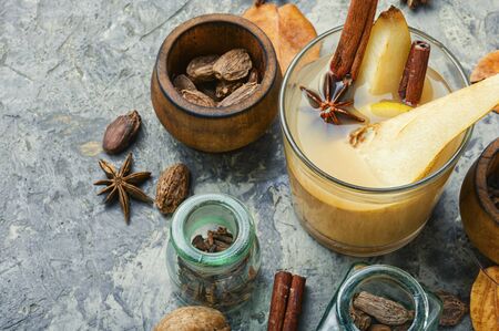 Autumn traditional popular mulled wine.Warm pear wine with spicy spices.の写真素材