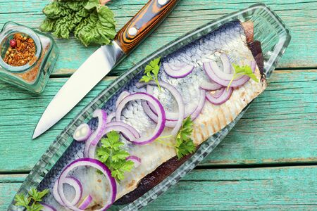 Delicious salted herring with red onion and pepperの写真素材