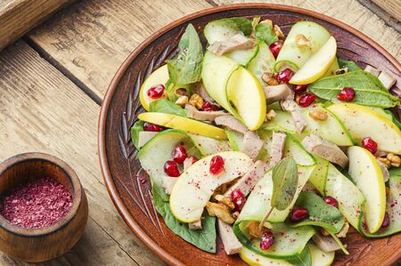 Appetizing salad of vegetables, fruits and meat tongue.Diet food.の写真素材