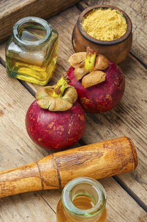 Healing fruit mangosteen in alternative medicine, mangosteen tinctureの写真素材