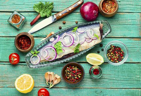 Delicious salted herring with red onion and pepperの写真素材
