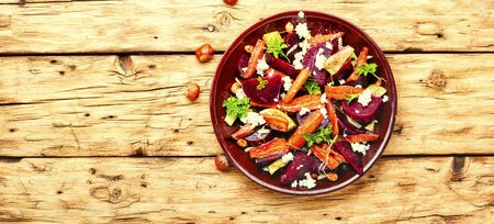 Salad with caramelized carrots, avocado, beets and nuts.の写真素材