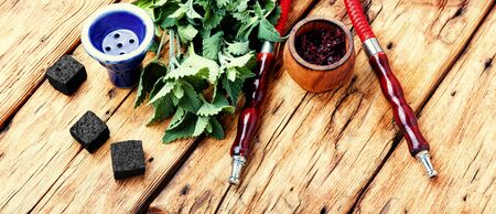 Asian smoking shisha with tobacco with mint flavor.Turkish tobacco hookah with spearmintの写真素材