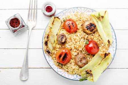 Pilaf,dish of oriental cuisine.Turkish pilaf with grilled vegetables.Pilaw in the eastの写真素材