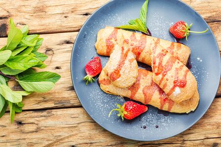 Appetizing homemade pies with strawberries and jam