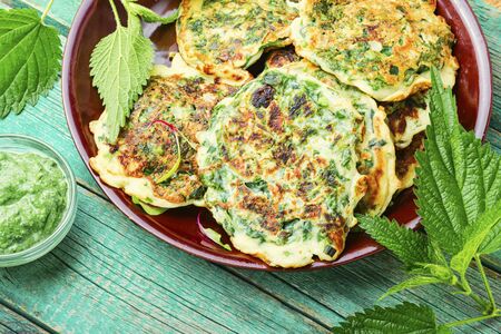 Healthy nutrition,diet fritters with nettles.Green pancakes with herbsの写真素材