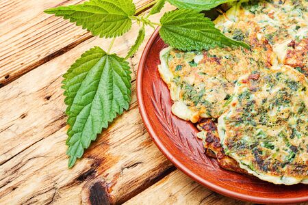 Healthy nutrition,diet fritters with nettles on a plateの写真素材