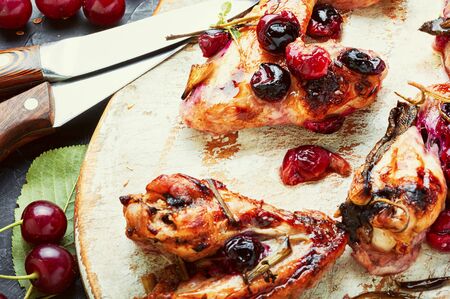 Fried chicken wings in spicy cherry sauce.Grilled chicken, fast food.の写真素材