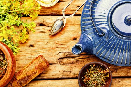 Fragrant useful herbal tea with hypericum.Herbal medicine.Tea with herbs.の写真素材