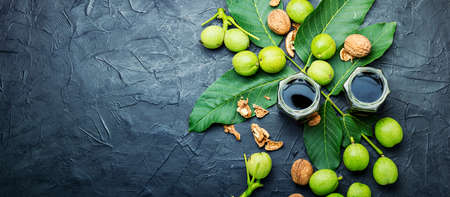 Healing tincture of unripe walnut. Green walnut in herbal medicine.の写真素材