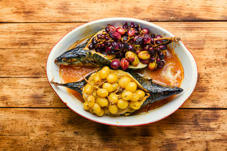 Baked mackerel or scomber in grape berry sauce.Roasted fishの写真素材