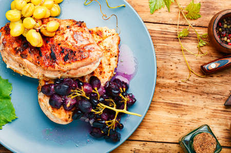 Grilled chicken breast marinated in grape sauceの写真素材