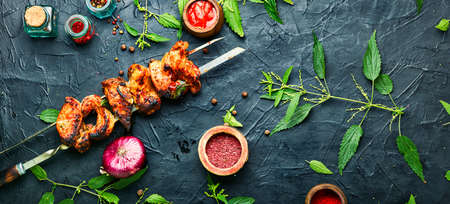 Appetizing shashlik on skewers with nettle marinade.の写真素材