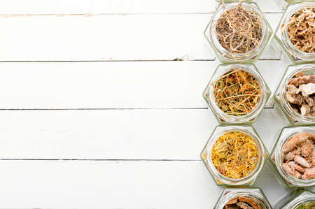 Large assortment of dried medicinal herbs, roots and bark.Copy spaceの写真素材