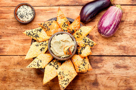 Babaganush or eggplant caviar from baked eggplant. Eggplant baba ganoush with flat breadの写真素材