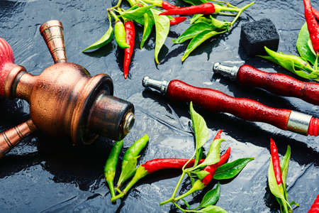 Shisha hookah with red pepper.Oriental hookah, exotic smoking hookah.