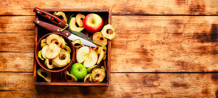 Apple chips on rustic wooden background.Healthy sweet snackの写真素材